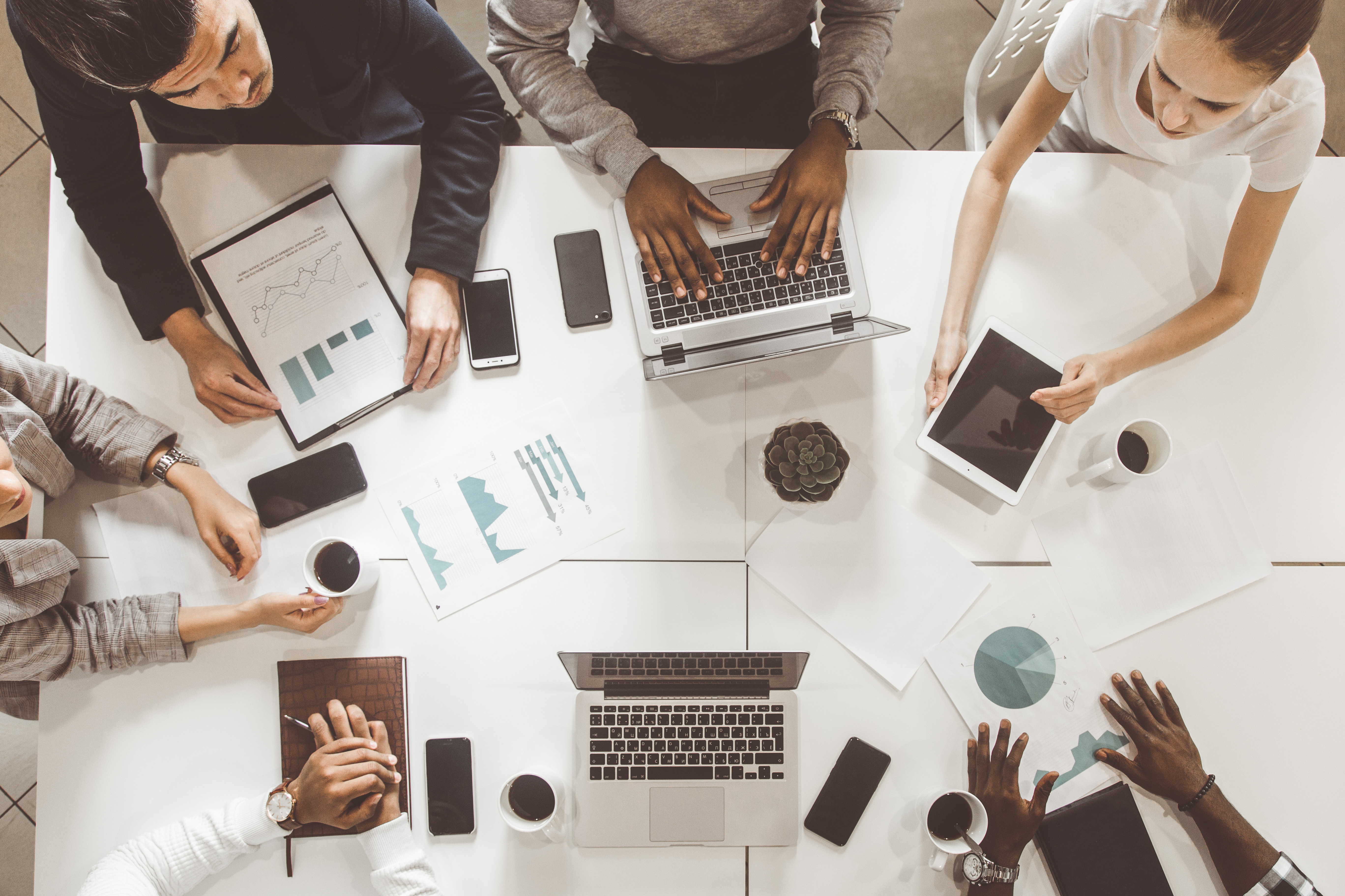 looking down upon a working group around a table