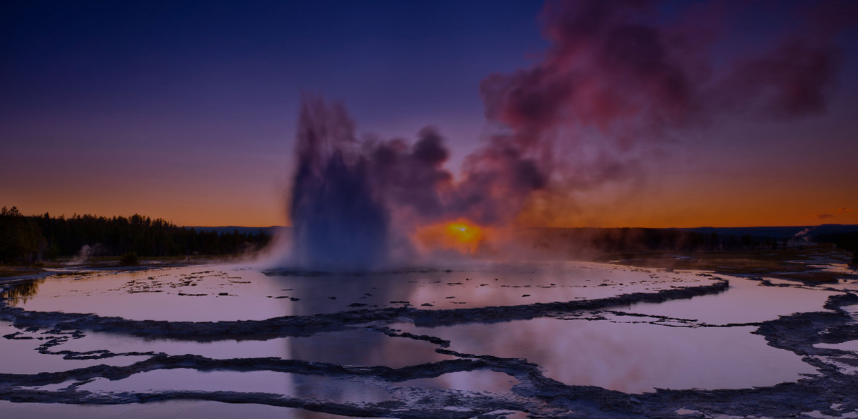 Image of a geyser at sunset