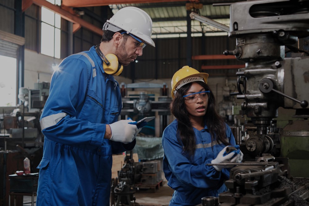 Two Industrial workers in protective gear