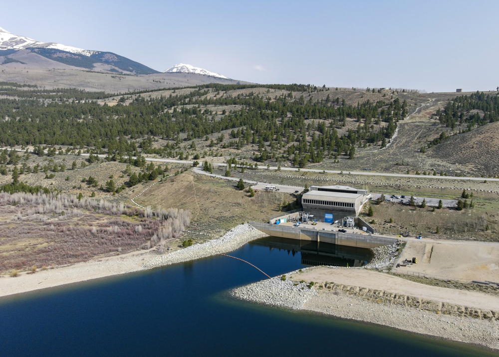 A pumped storage hydropower facility, with mountains in the distance