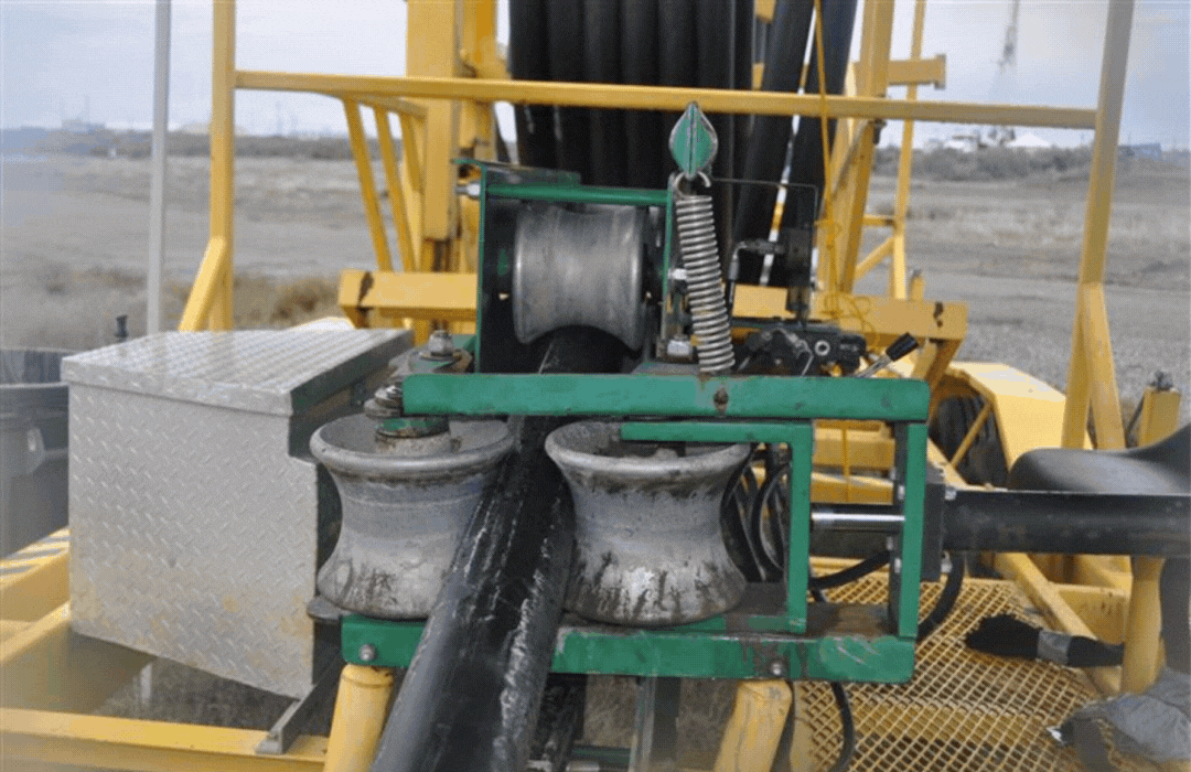 Workers with EM contractor Central Plateau Cleanup Company are installing piping to expand the Hanford Site’s groundwater treatment network. They use a specialized machine to straighten hundreds of feet of coiled piping and reduce the number of connections, significantly improving efficiency in the field.