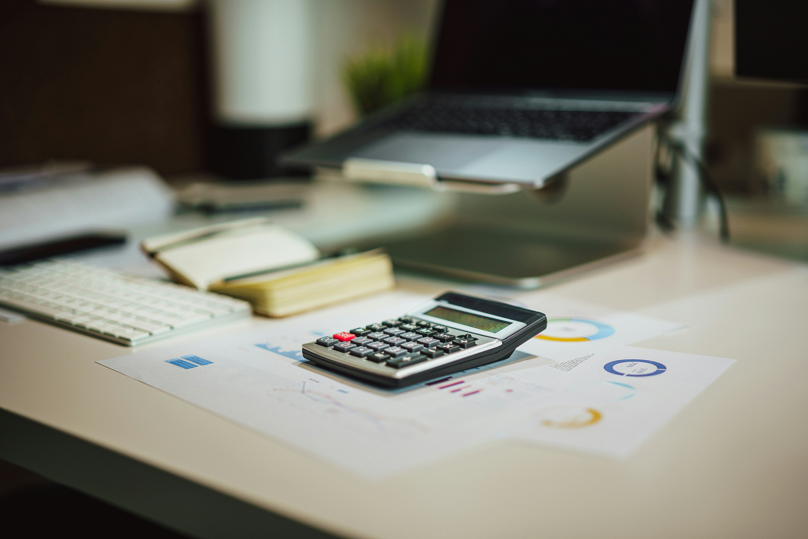 Charts and calculator on a desk