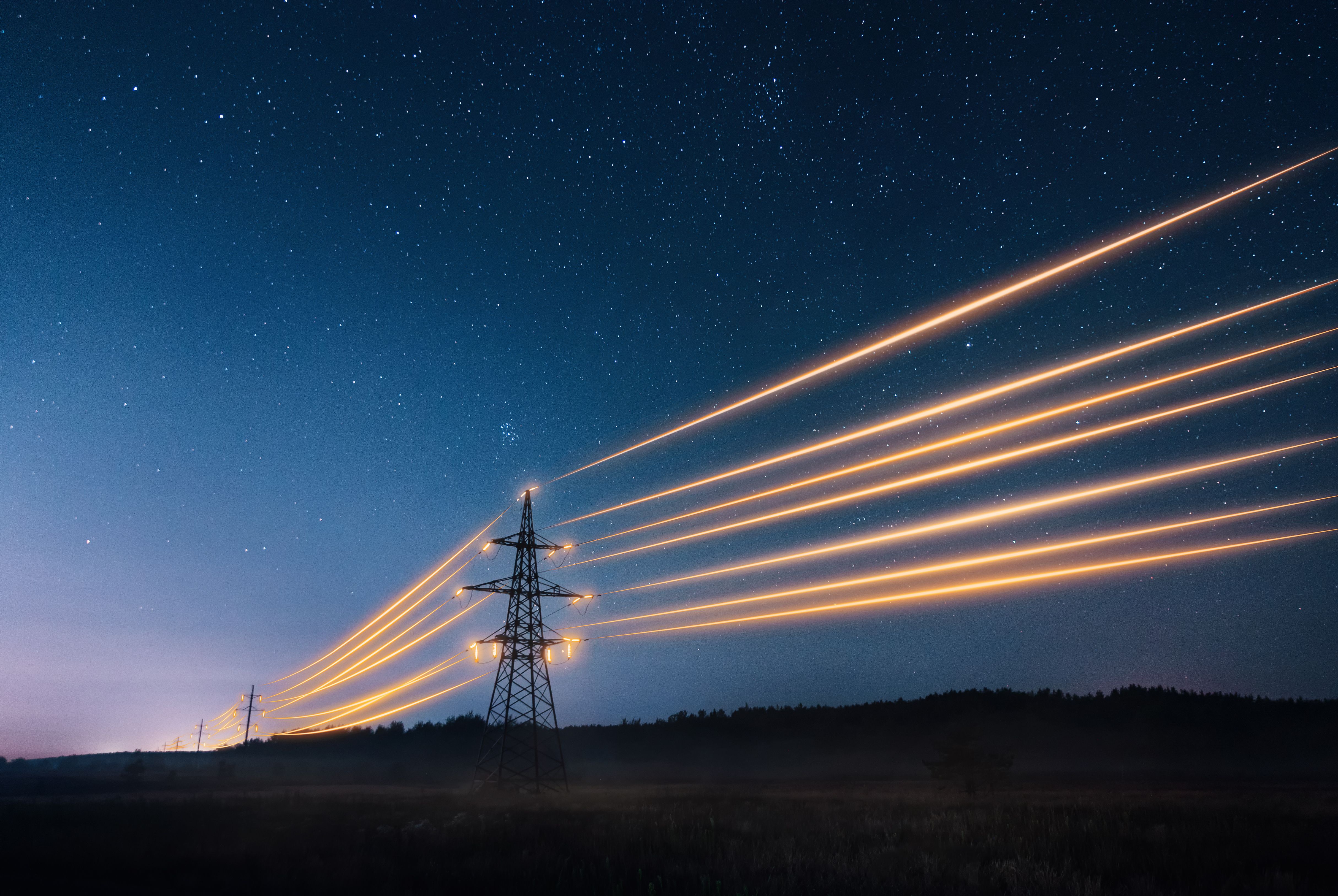 Image of a powerline at night