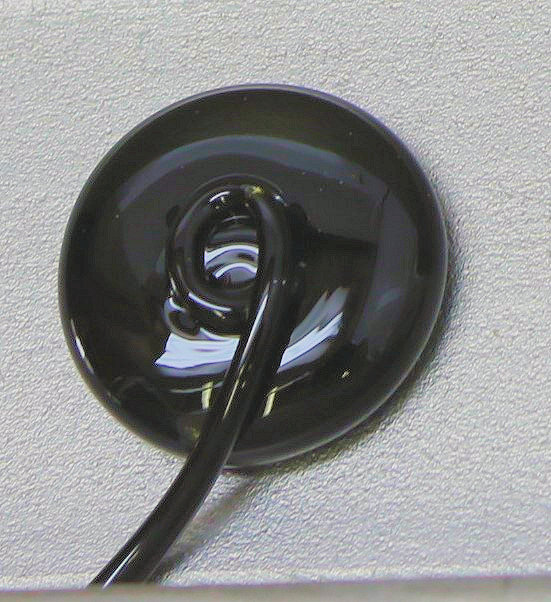 A black circular object