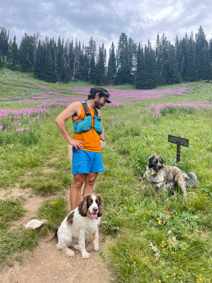 Gallego-Calderon with his two dogs on a trail