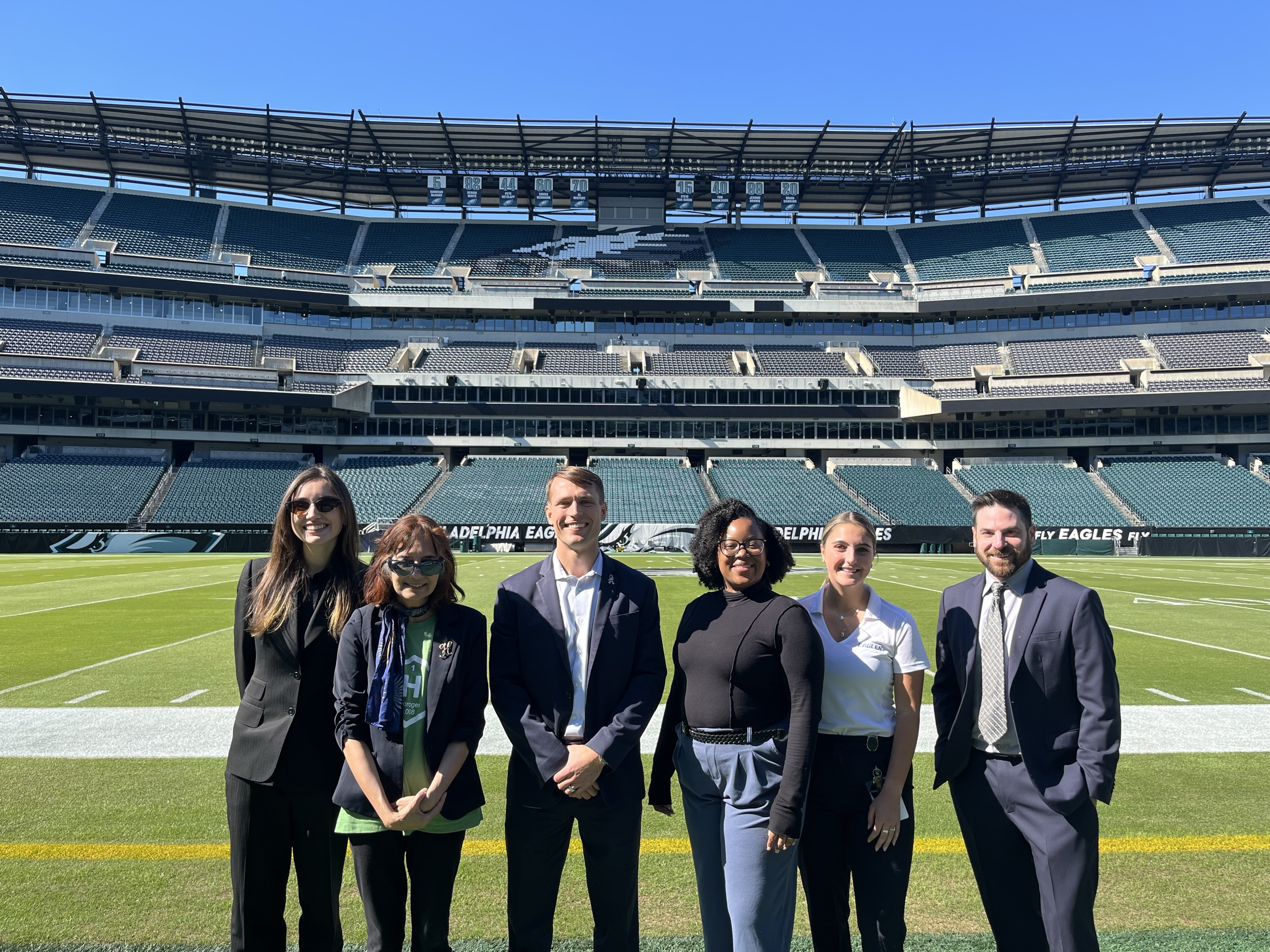 HFTO Director Dr. Sunita Satyapal with DOE colleagues and representatives from the Eagles organization