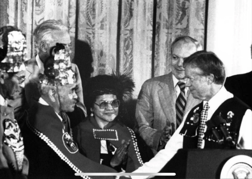 Angoon elders Matthew Fred, William Nelson, and Martha Nelson with President Jimmy Carter at a ceremony for the protection of Admiralty Island via the Alaska National Interest Lands Conservation Act.