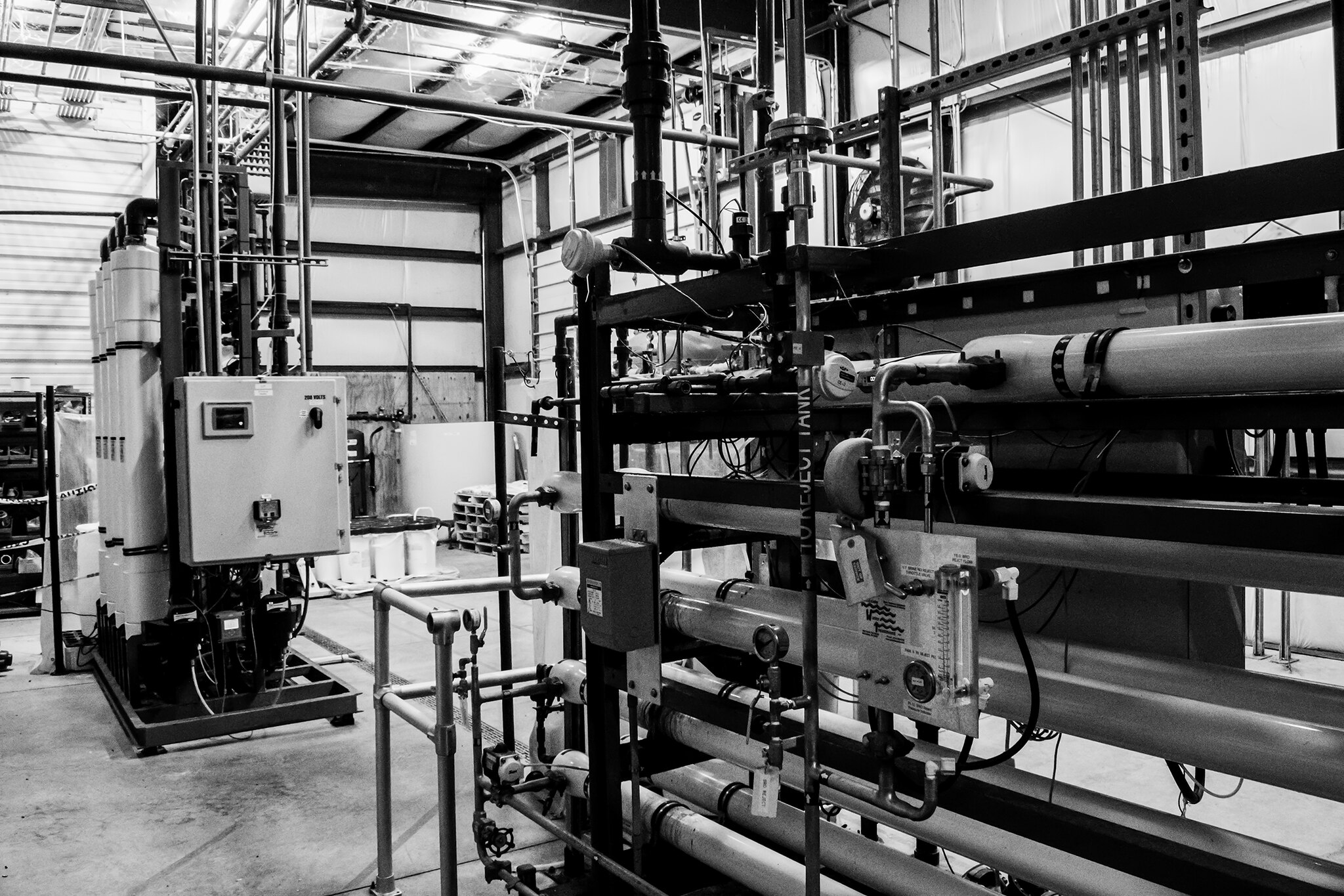 A photo of a water treatment system in a factory setting.