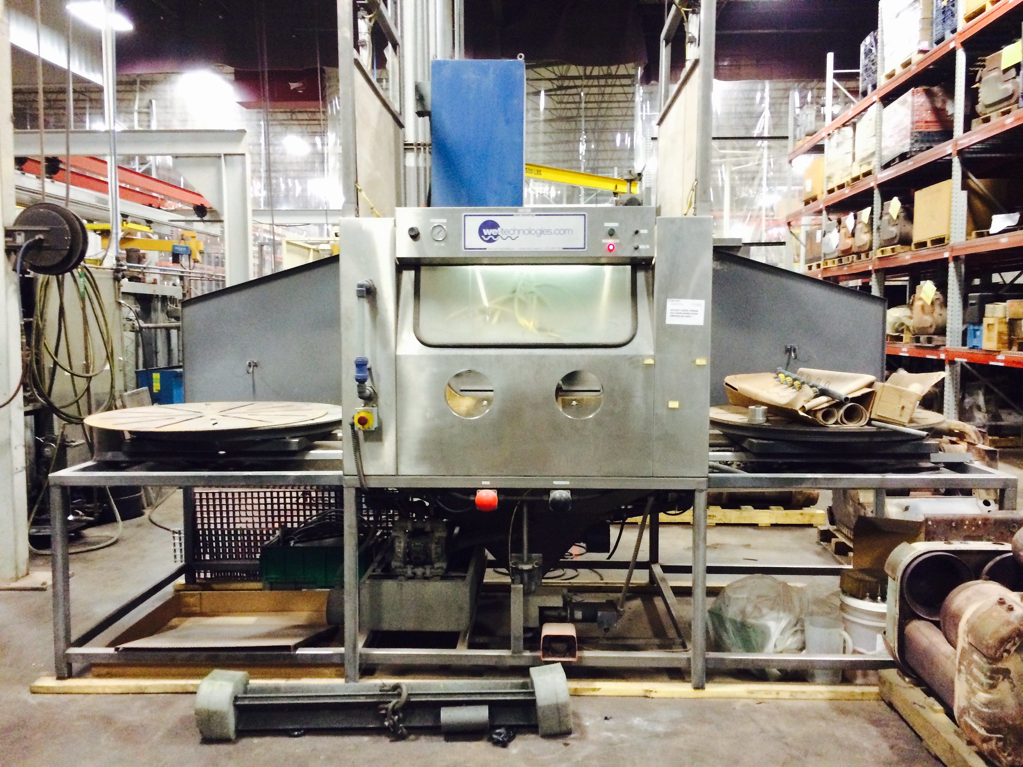 A converted sand-blasting machine in a factory setting.