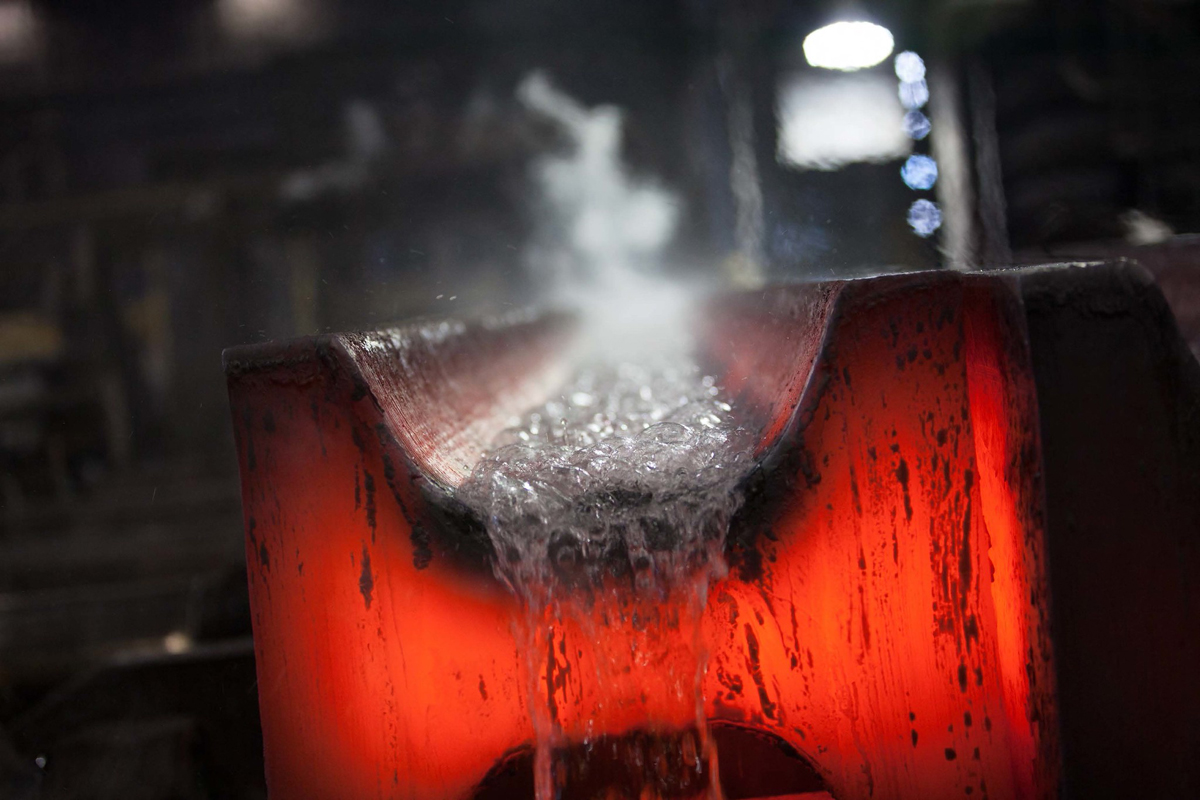 Bubbling water runs over red-hot I-beam.