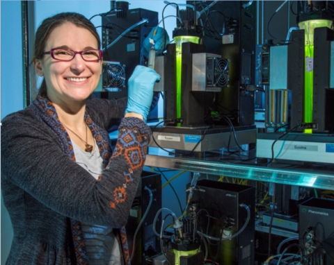 Photo of Amanda Barry inside of an algae lab.