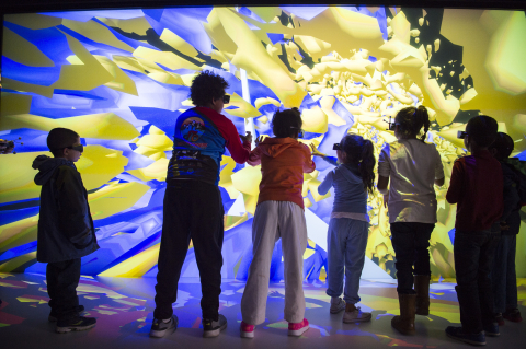 Kids visiting NREL enjoy a 3D Wind Illustration