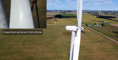 A drone conducts an aerial inspection of a wind turbine.