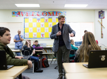 Terry Wallace visits students during the Hour of Code. 