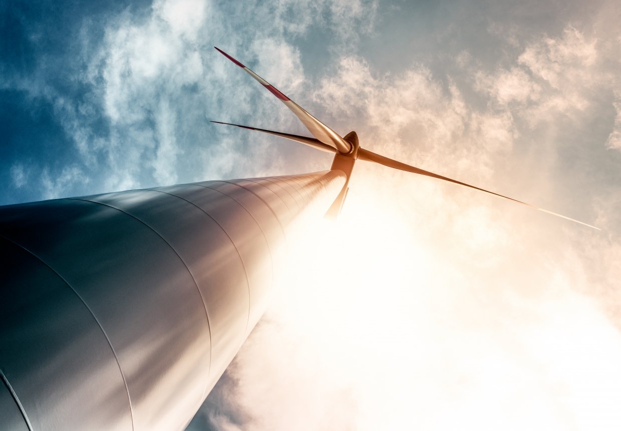 View of a wind turbine from below. 