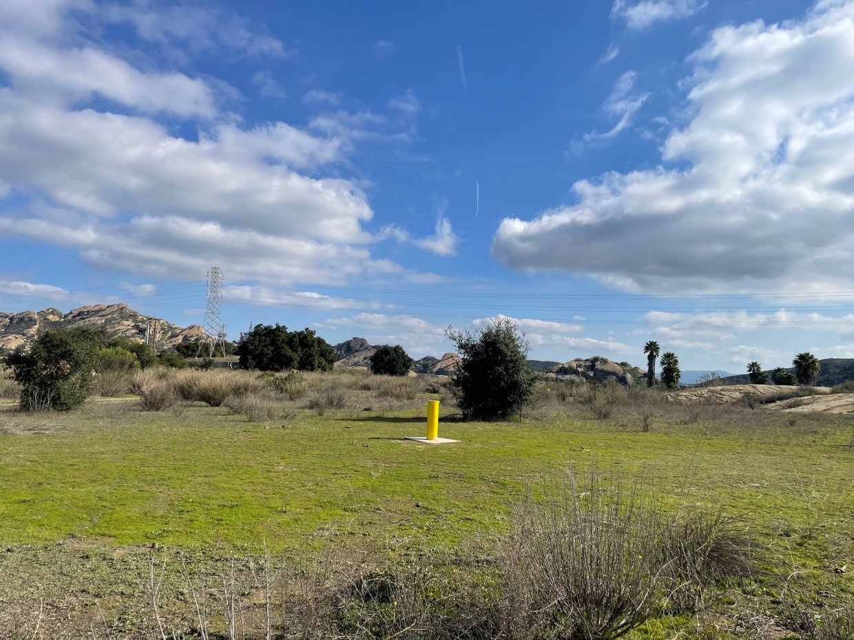 View of the former Hazardous Material Storage Area with a yellow marker