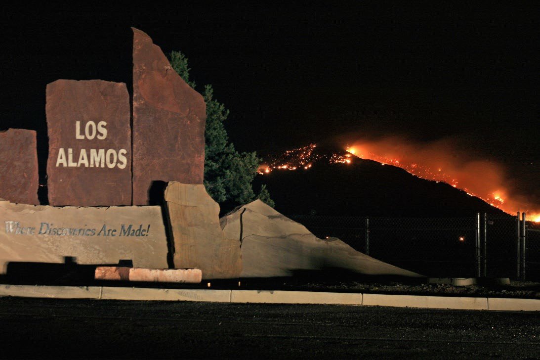 Fire in the background of LANL Site sign