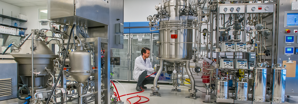 A scientist works on equipment inside Lawrence Berkeley National Laboratory's Advanced Biofuels Process Development Unit