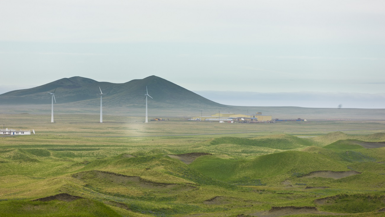 Photo of wind turbines and mountains.