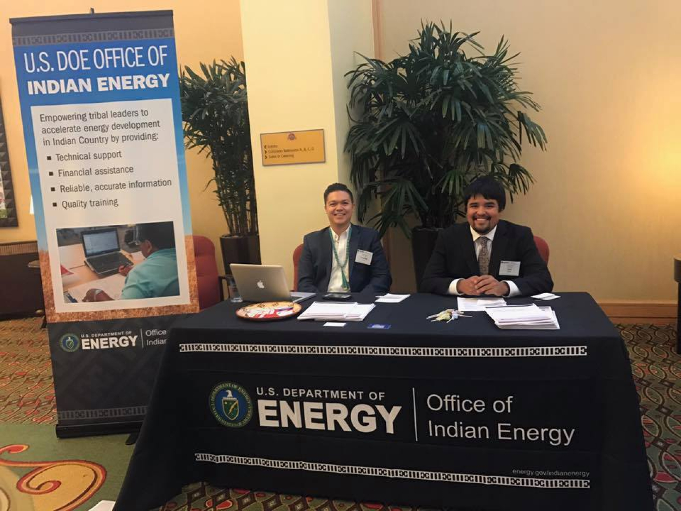 Photo of two men at a booth