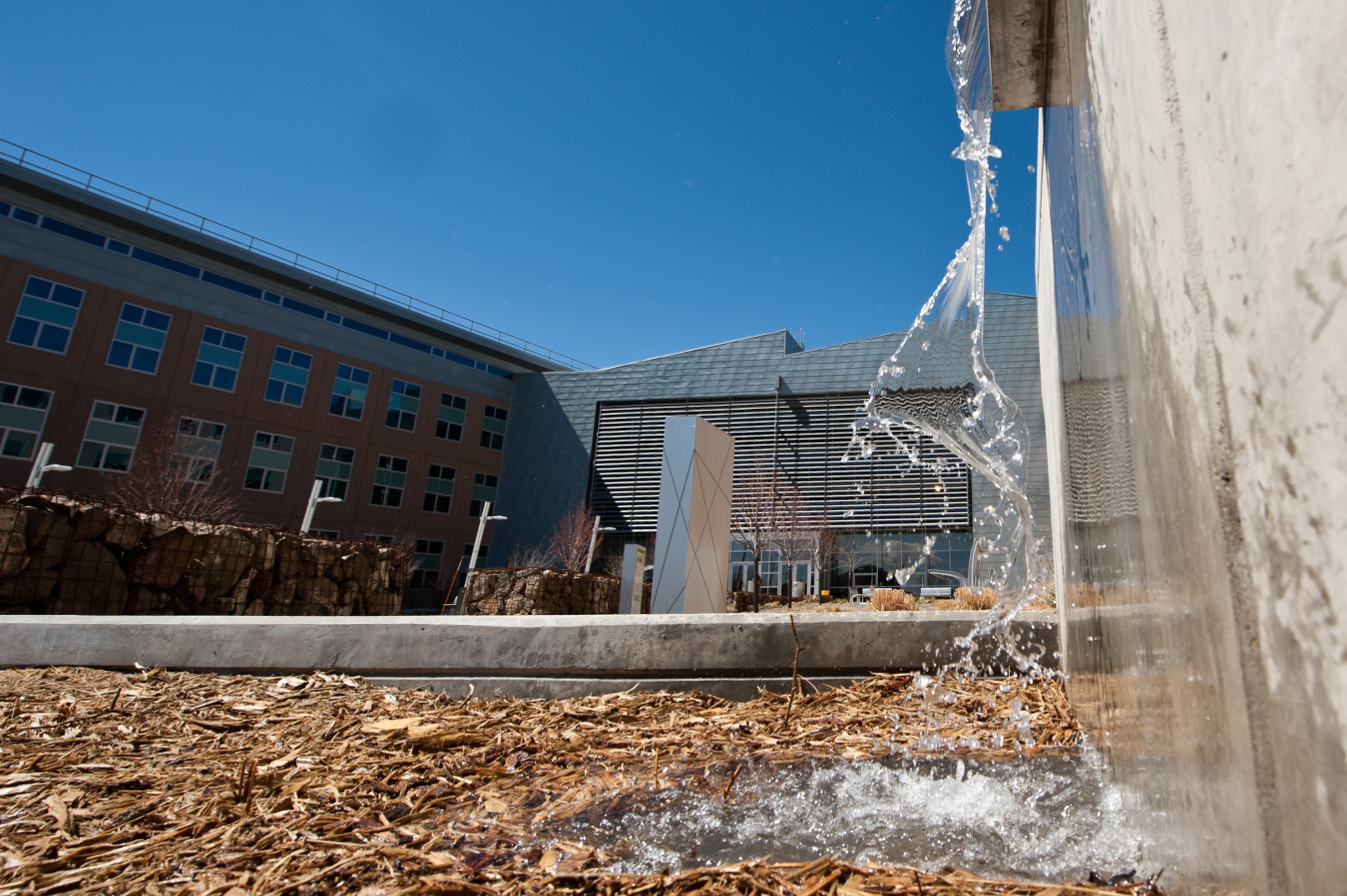 Photo of snow melt running off a building.