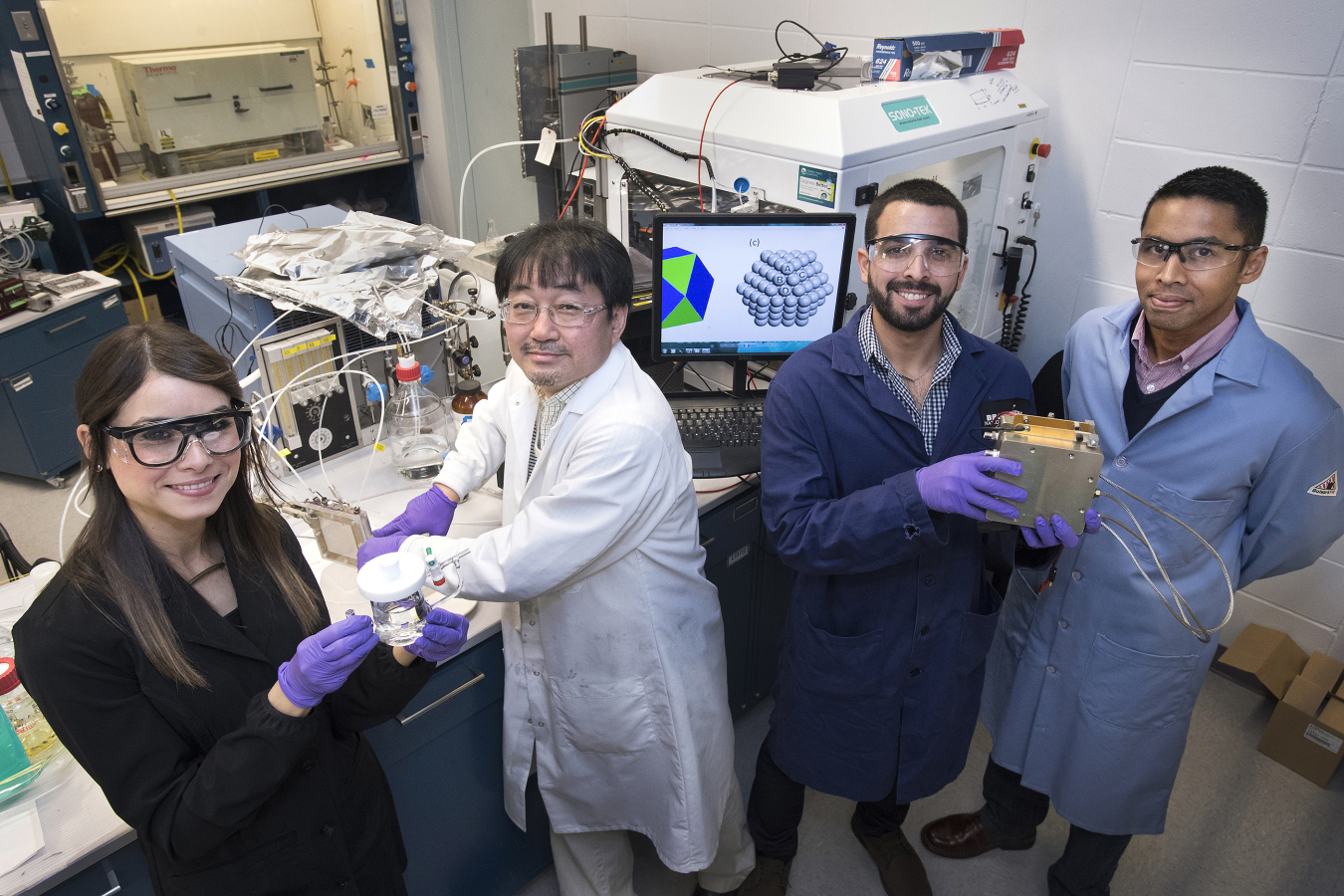 In Brookhaven Lab's Chemistry Division, Melissa Vega Cartagena and Luis Betancourt De León (left and third from left, respectively) were two of five students from the University of Puerto Rico who were able to continue their research at Brookhaven.