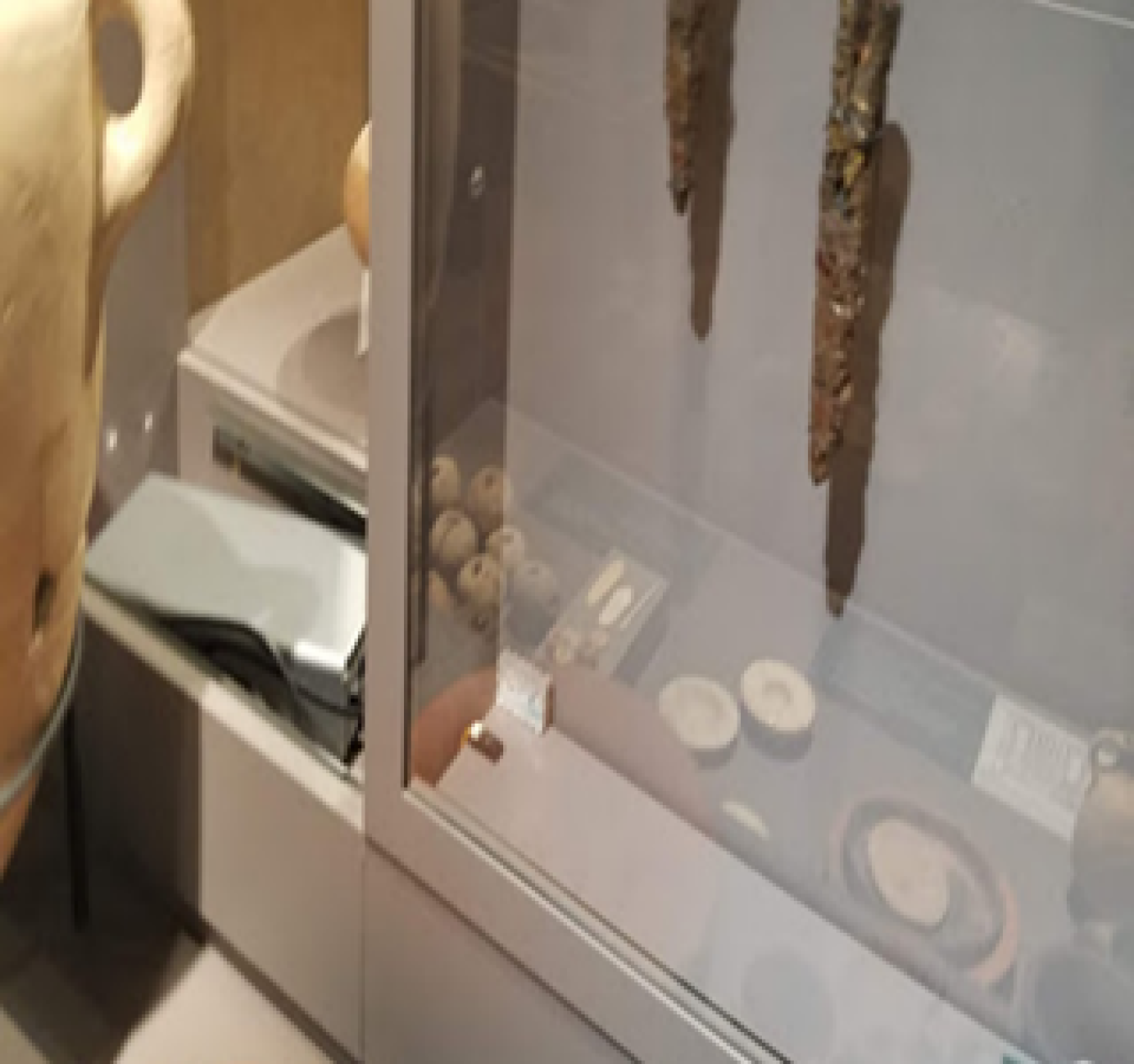 Showcase at the Museum of the Bible housing 2500-year-old spears, including a humidity sensor in the case and controller nested next to the case.