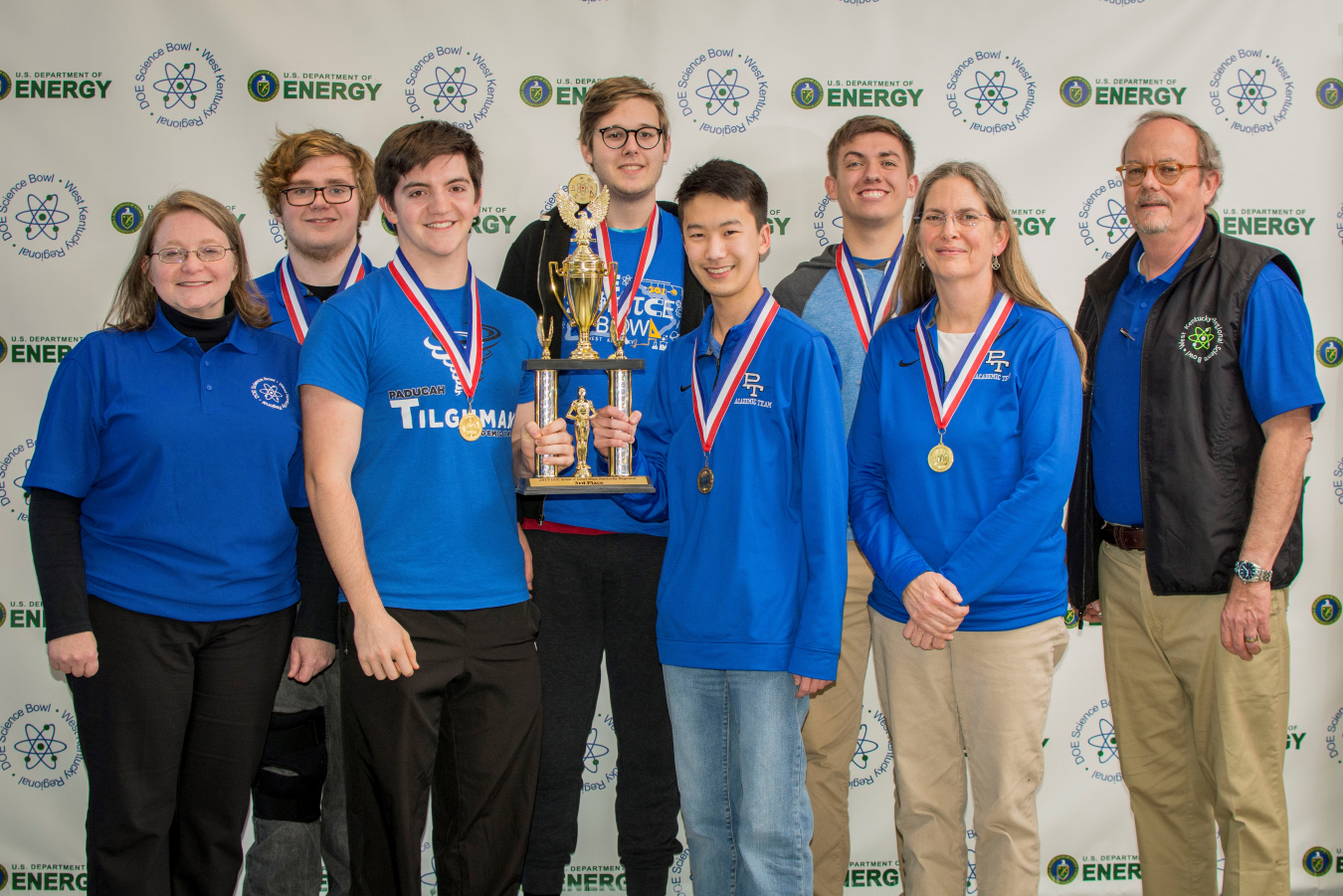 Third-place Paducah Tilghman High School (left to right): Jennifer Woodard, DOE Paducah Site Lead, Samuel Lambert, Ryan Chua, Christine Wynn, PTHS Coach, Buz Smith, DOE Science Bowl Coordinator. Back row: Travis Trimble, Austin Yarbrough, Lance Butler