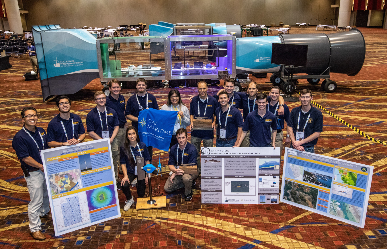 Photo of college students with wind tunnel.