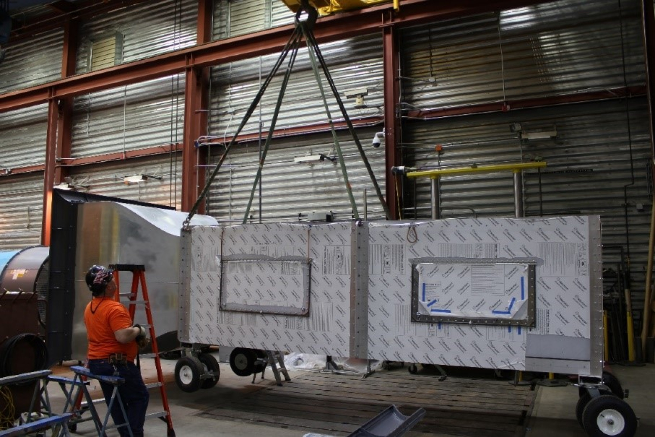 A man lifting heavy machinery at the National Wind Technology Center.