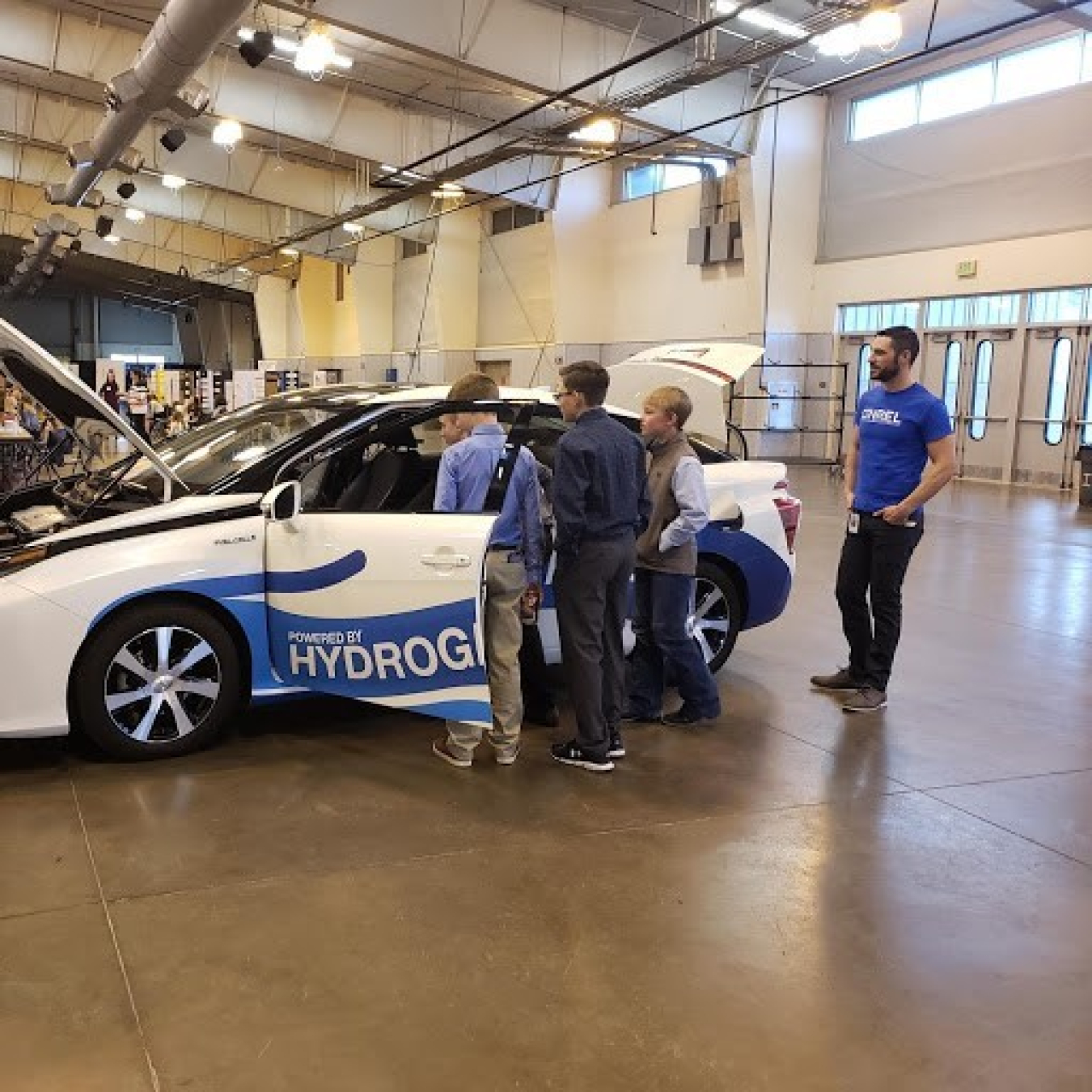 Students look inside a Toyota Mirai fuel cell electric vehicle