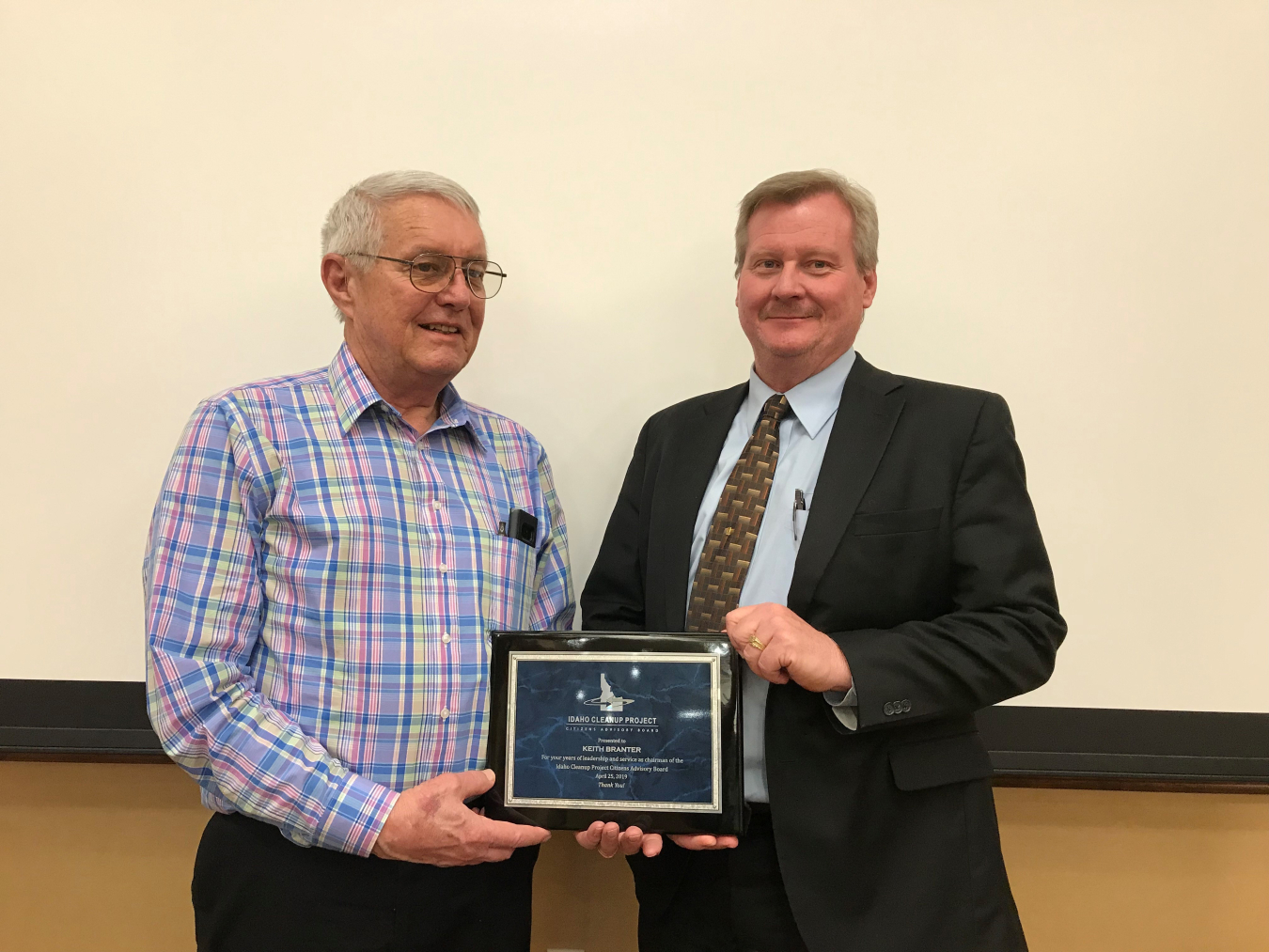 Keith Branter (left), former ICP CAB Chair, receives a plaque commemorating his service from DOE’s Jack Zimmerman at the April 25, 2019 meeting in Twin Falls.