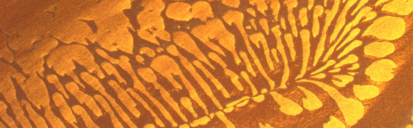 Image of an optical micrograph of self-assembled metal/dielectric nanoparticles. These tiny particles control the reflection, absorption and transmission of light.