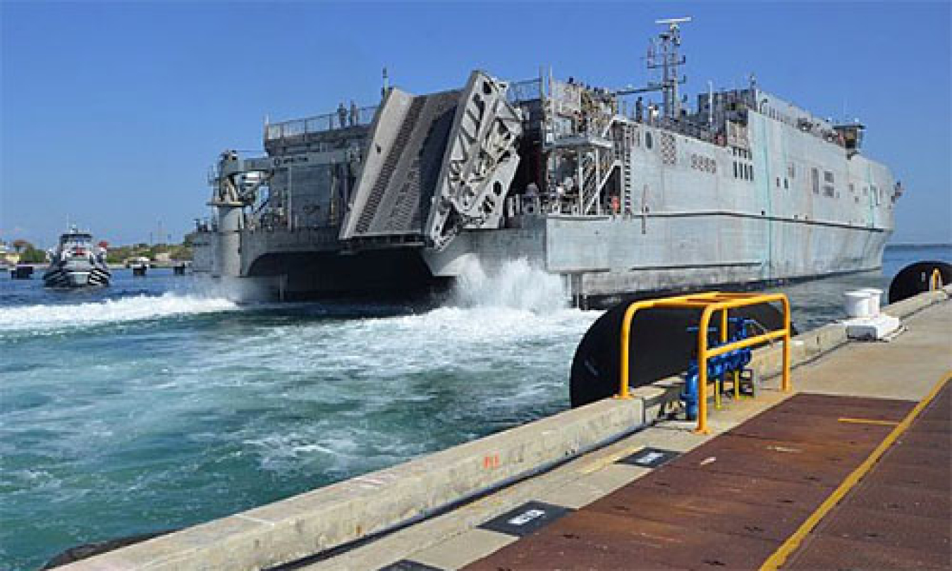 The Whidbey Island-class amphibious dock landing ship USS Gunston Hall is moored in Naval Station Guantanamo Bay, Cuba, for a scheduled port visit. 