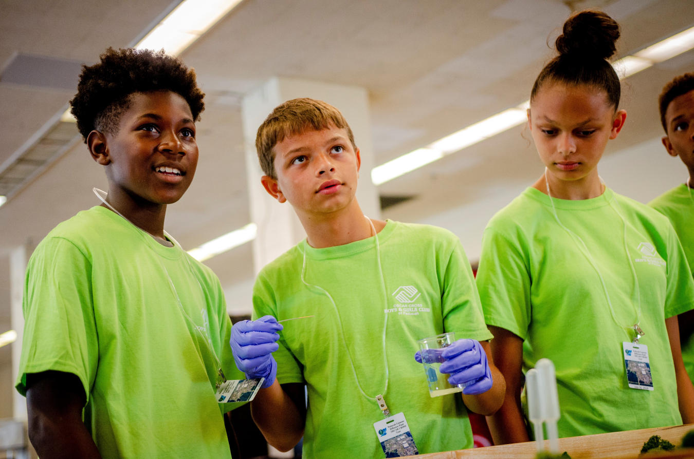 Oscar Cross Club members (left to right) Jakevion “DJ” Perry, Chris Moore, and Madison Moore participate in a hands-on activity about groundwater remediation.