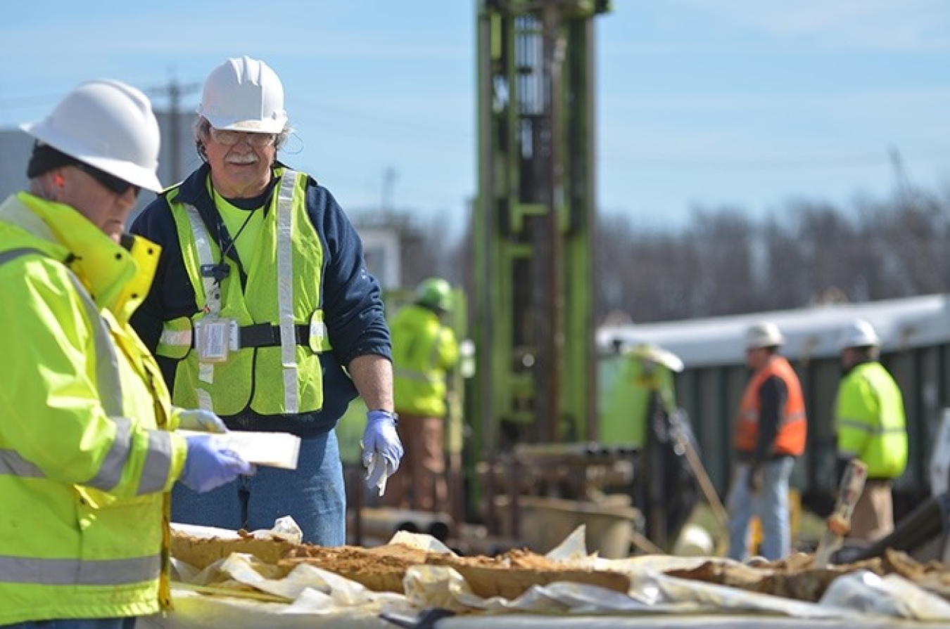 Geologists Rob Flynn, left, and Ken Davis examine core samples used to determine the location of the wells to optimize pump-and-treat operations at the Paducah Site’s northeast groundwater contamination plume.