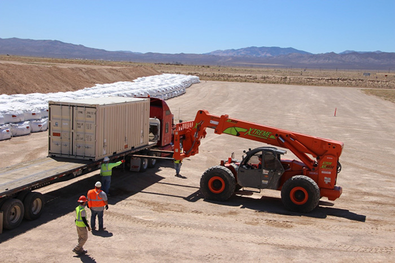 The final Clean Slate III shipment is lifted off a truck for permanent disposal at the Nevada National Security Site Area 3 Radioactive Waste Management Site.