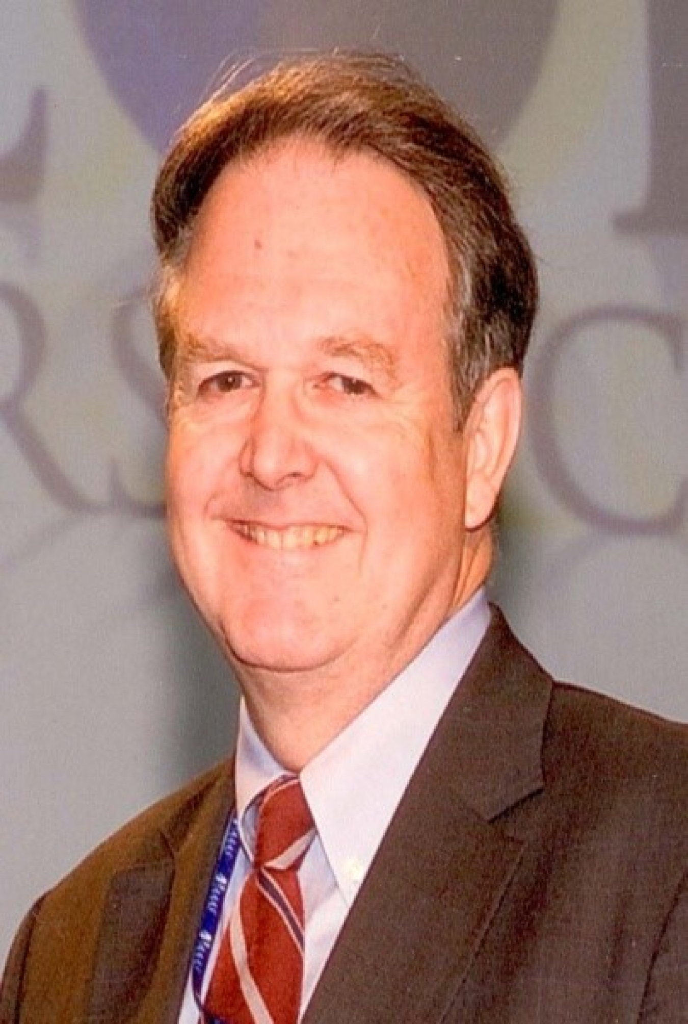 Head shot of man in suit and tie