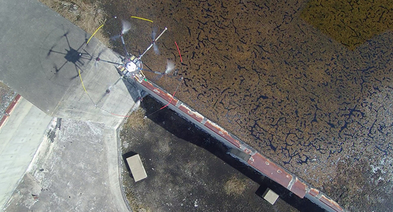 A view of an aerial drone gliding above the rooftop of a sealed and closed reactor building at the Savannah River Site.