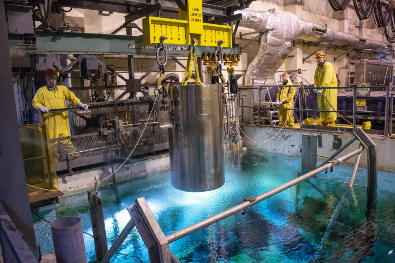 Employees with Savannah River Nuclear Solutions (SRNS), the Savannah River Site management and operations contractor, safely lower a fuel cask into the SRS L-Basin for storage until its ready for final disposition.