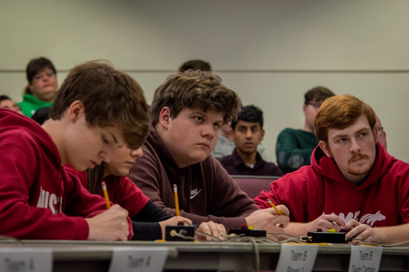 McCracken County High School team members Jake Mitchell and Ben Schofield (right) look to the moderator to find out if an answer is correct.