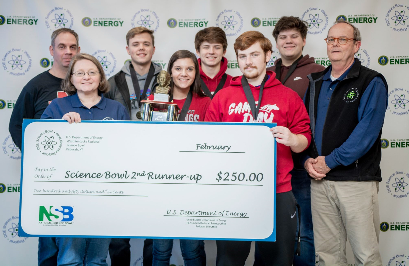 McCracken County High School placed third. (Left to right) Coach Matt Shelton, DOE Paducah Site Lead Jennifer Woodard, Reese Hutchins, Ella McBee, Mason Wooten, Ben Schofield, Jake Mitchell and DOE's Buz Smith are shown.