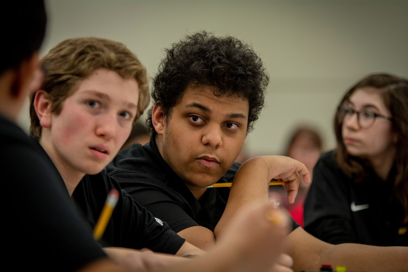 Lone Oak Middle School Team One members Owen Cody and Cole Cannon listen for the question during a round at the DOE Regional Science Bowl Middle School competition.