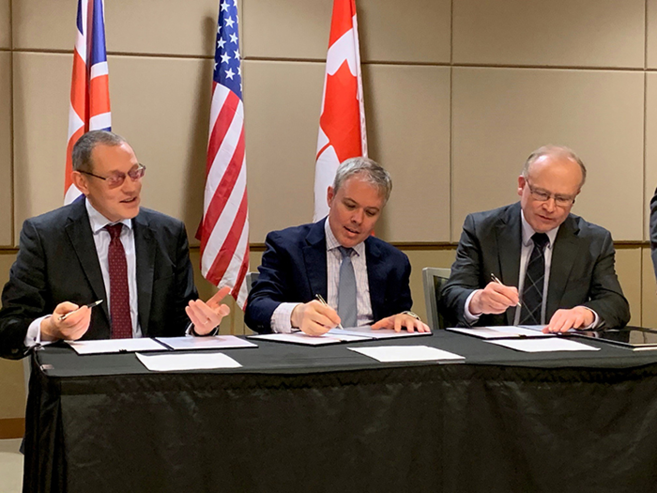 Ike White representing EM; and Alastair MacDonald of Atomic Energy of Canada Limited, took  part in a signing ceremony at the Waste Management Symposia 2020 in Phoenix.