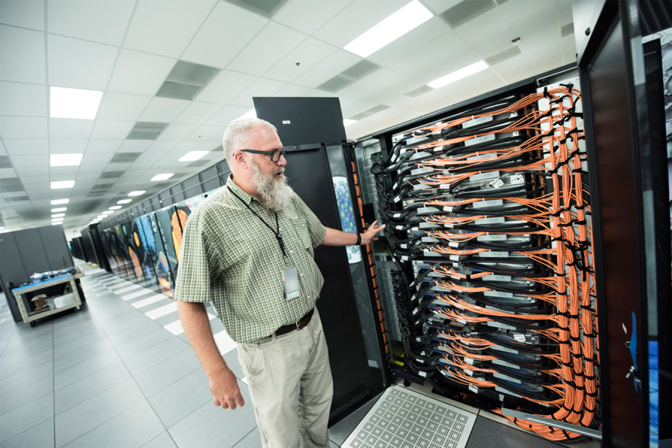 ALCF Director Michael E. Papka in the machine room that houses several supercomputing systems at Argonne National Laboratory, including Theta.