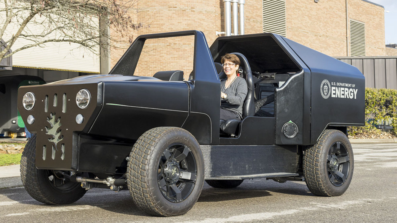 Woman sitting in a U.S. Department of Energy vehicle.