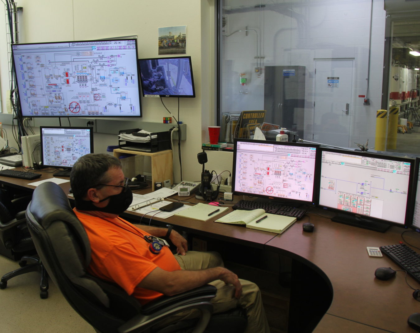 Steve Rust, a nuclear chemical operator for contractor CH2M HILL Plateau Remediation Company, monitors the performance of the 200 West Pump and Treat Facility from the control room on the Hanford Site. 