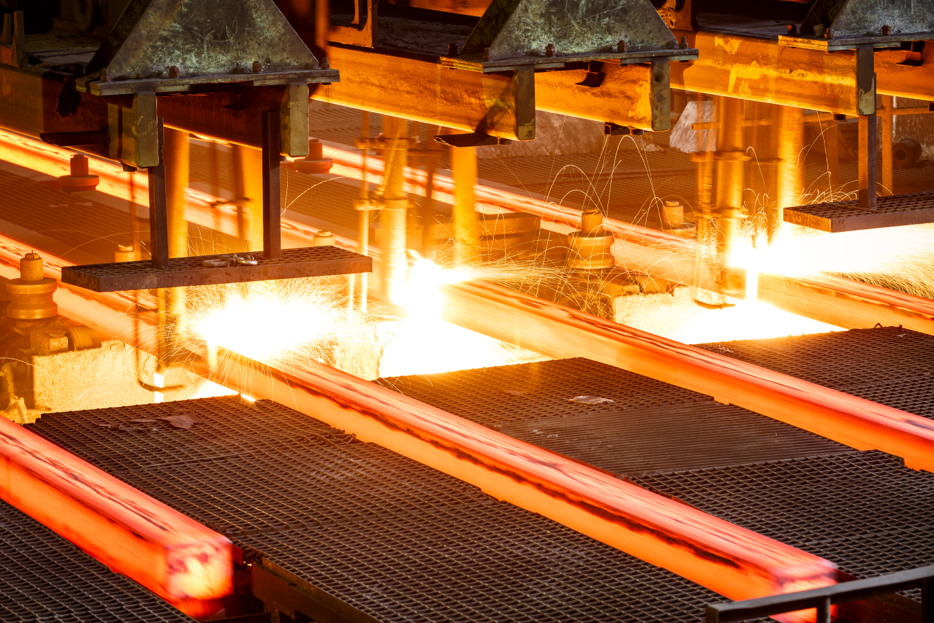 Hot steel going through conveyor belt at a steel manufacturing plant