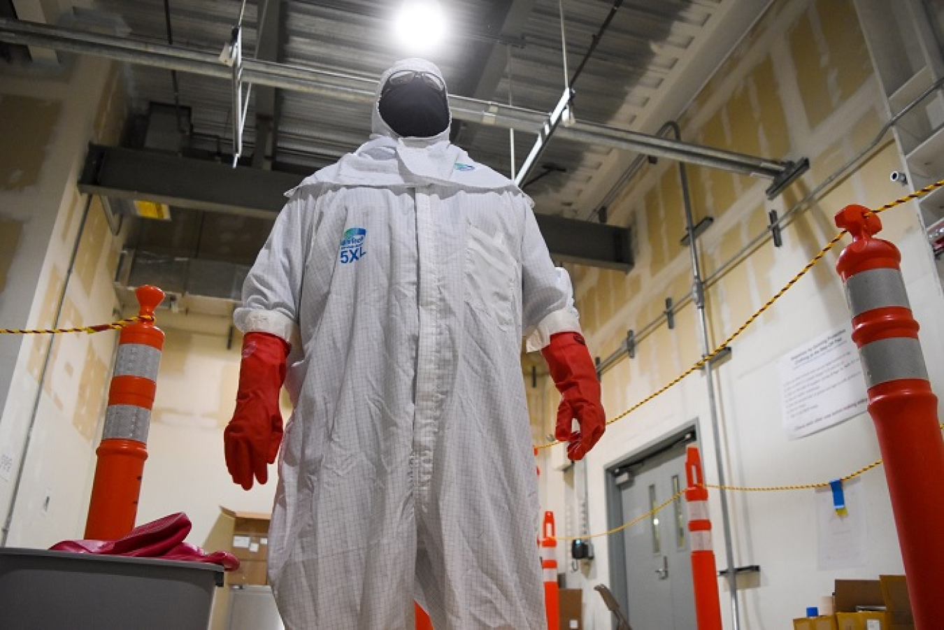 Waste Treatment and Immobilization Plant Commissioning Technician Quirino Quiroga learns to don and doff personal protective equipment as part of radiological worker training. This training signifies another important step toward commissioning and eventual operations for the Direct-Feed Low-Activity Waste process.