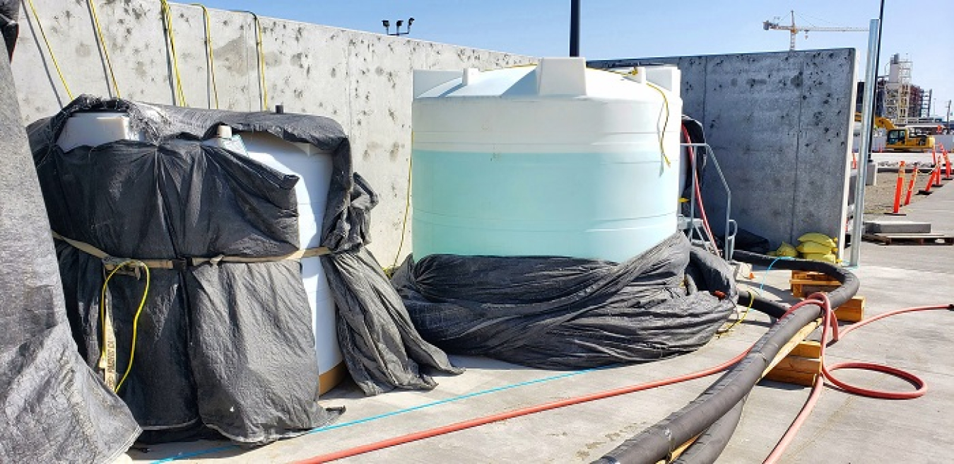 Large tanks hold water that simulates tank waste during commissioning of the Tank-Side Cesium Removal system on the Hanford Site.